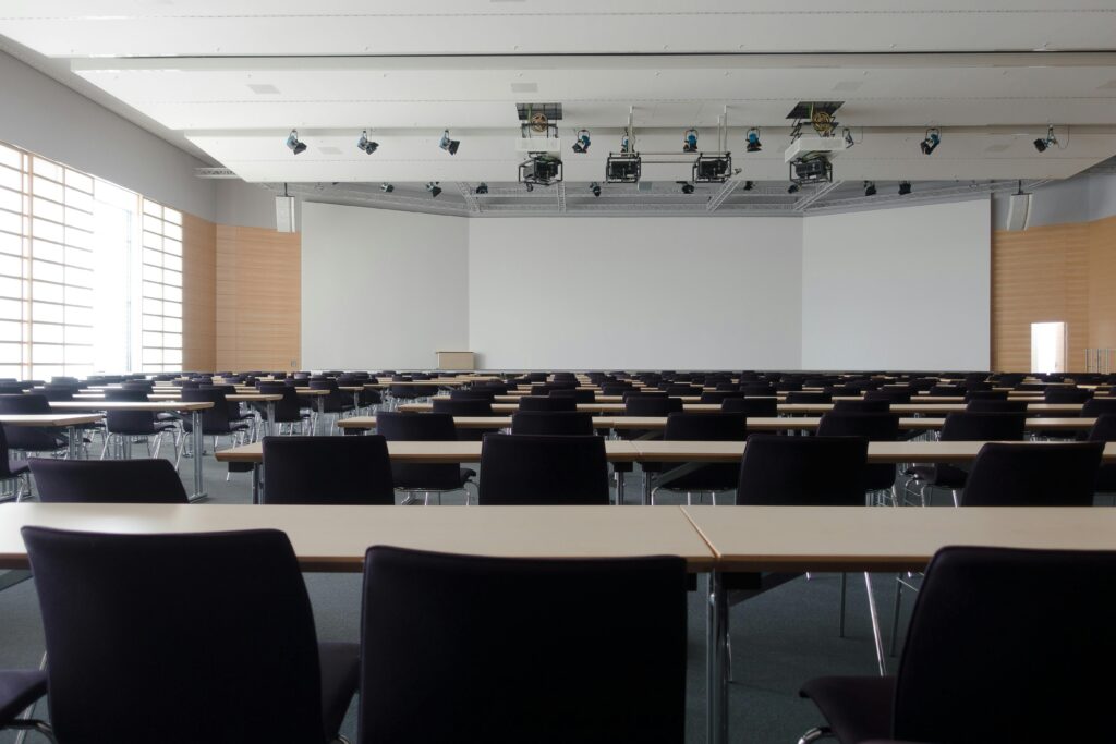 Empty conference room with tables and chairs